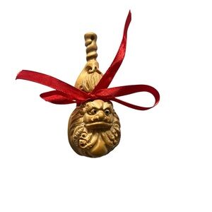 Carved Wood Lion Ornament with Red Ribbon